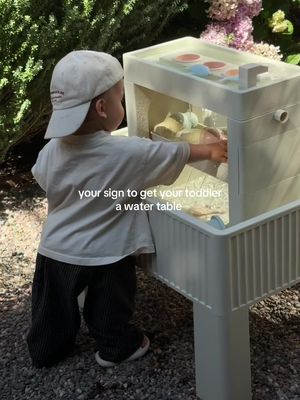 his new favorite activity #toddler #momtok #watertable #toddlerboy 