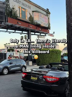 This is one of those “only in Los Angeles” moments. 😂 Yes… that is a REAL HUMAN living inside a billboard above Sunset Boulevard. 😳🏠 Netflix basically looked at a normal billboard and said, “Nah… put a whole house up there.” 😂 The installation was created for The Last House, Netflix’s new sci-fi thriller. A live performer is actually staying inside the furnished billboard, interacting with people on the street through the windows and a whiteboard. The idea connects directly to the movie, where a family suddenly finds themselves mysteriously sealed inside their home with no way to escape. Except here, instead of being trapped in private… you have half of Los Angeles staring at you while sitting in traffic. 💀😂 And yes, I went to see it in person because apparently seeing a man casually living above Sunset Blvd is part of my job now. 😂 📍 Sunset Boulevard / Sunset Strip, Los Angeles 📅 August 6–8, 2026 🏠 Real live performer inside the billboard 🎬 The Last House 📺 Now streaming on Netflix If you’re driving down Sunset Blvd, LOOK UP. 👀 You might catch him staring back at you. 😂 LA rent is officially getting out of control. 💀🏠 #LosAngeles #SunsetBlvd #SunsetStrip #OnlyInLA #TheLastHouse