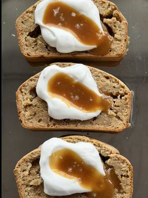 Baking banana bread = therapy  Warm slices of miso maple banana bread topped with creamy coconut yoghurt and a miso peanut caramel. A healthier bake that hits all the sweet, salty and savoury notes. 🍌Visit my website (link in bio) and search “Miso Maple Banana Bread” for the full recipe. #veganbananabread #plantbasedbaking #bananabread #veganrecipes #homebaking