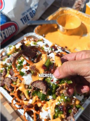 Beer Cheese Pretzel Nachos 🤯 - Grill your brats - Mix 8oz sharp cheddar, 8oz white cheddar, one block cream cheese, 2tsp worcestershire, 2tbs mustard, 12oz of beer and BBQ rub - Place on indirect heat at 350 - Stir after 30 minutes then grill for 15 more - Top pretzels with beer cheese green onion, sour cream, jalapeño, and brats