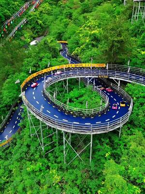 Real-life Mario Kart in China?! 🏁🎮📍👇 📍 OMG Park – Hangzhou, China 🇨🇳 💨 Race down the mountain on this insane mountain kart track at OMG Park!  🏎️ Speed through winding mountain roads, sharp turns, and scenic forest views as you make your way down the track. It seriously feels like Mario Kart came to life!  ⛰️ One of the most fun and unique ways to experience the mountains near Hangzhou! 🫶🏼 Send this to the person you’d want to race down the mountain with!  #mariokart #bucketlisttravel #adventuretravel #china 