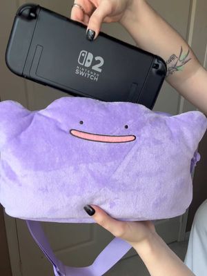 ✨ This is the official Ditto Plush Pouch for the Nintendo Switch 2 from HORI! It holds any Switch model, including the charger and 6 games! Out of the two Ditto Switch 2 cases that were released, I absolutely love that this one is plush and looks just like you’re walking around with a Ditto! 🥹💜 I was able to preorder it from @Meccha Japan!  #pokemon #ditto #pokopia #nintendoswitch2 #pokemonplush 