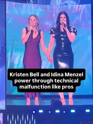 Sisters help each other in a pinch! 'Frozen 3' stars Kristen Bell and Idina Menzel's performance hit a glitch during a big entertainment showcase at D23: The Ultimate Disney Fan Event, but they powered through like pros, with Menzel squeezing Bell's hand to help her keep the beat. #D23 #Frozen #IdinaMenzel #KristenBell #Disney