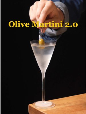 Olive Martini 2.0 Olives, Manzanilla Sherry Look I love a dirty martini for the olive flavor but sometimes it's just a little too salty. This martini solves for that with olive gin, olive distillate, manzanilla sherry, and just a bit of saline. Served with an olive, and garnished with some olive oil. Its rich, nutty, savory, and well, olive forward. 1.5 oz olive gin  0.5 oz olive distillate .25 oz manzanilla sherry saline olive, as garnish olive oil, as garnish Add olive gin, distillate, sherry, and saline together in a mixing glass, and stir down with ice. Pour into a cold cocktail glass, garnish with olive and olive oil. #cocktails #fyp #mixology #olive #martini