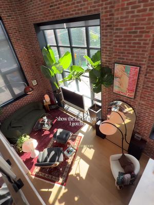 welcome to my loft 🤍 • • #interiordesign #apartmentdecor #homedecor #homeinspo #homebody • • mid-century modern | toronto interior | brick loft living | warm light | lived-in spaces | hard loft | tall ceilings | large windows | natural light | vintage furniture | statement lighting | plants | architectural details | open living | modern apartment | home atmosphere | interior styling | design focused | quiet spaces