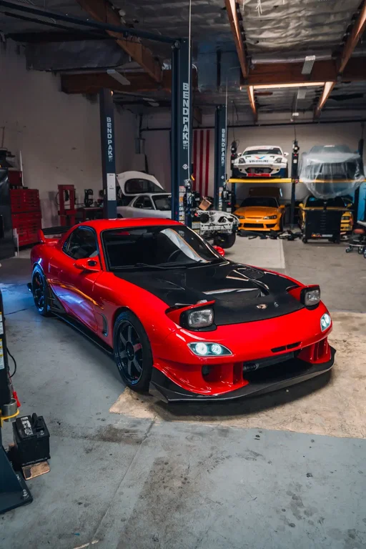Red is the new BRG 😅 after a quick 5 weeks the “abandoned” RX7 R2 is back to life. Repainted in Mazda Vintage Red and 100% restored inside and out. The drivetrain came out of my White FD which has the PPRE 2 rotor and exterior parts. The interior from the R2 was nearly flawless and swapped a few pieces from my white FD. I still have a few pieces coming for this FD that I’ve been waiting for the right reason to purchase and I’m patiently waiting on their arrival 🙂 and after 10 years, I’ve finally converted back to the pop ups 😂 now here’s the part I’m unsure of. Does the MagBlue work on the red? Most would say no, but call me crazy I think it kinda works? I kinda love it? I’m not sure yet but until the clarity arrives they will stay until I find a replacement. Let me hear your thoughts!