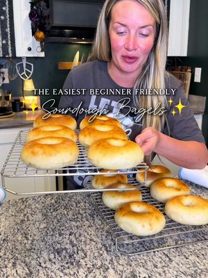 ✨Simple Sourdough Bagels✨ I know I say “simple” but what I mean by that is absolutely delicious and full of flavor… just easy to make.  If you are new to Sourdough…. or if you just love delicious Sourdough items…. Honestly, this is just the recipe for everybody, everyone will love them, and they’re super SIMPLE to make…. go make them now… k, bye.  INGREDIENTS: • 464g water • 332g active starter • 1,112g flour  • 55g turbinado sugar (or white. Idc) • 55g maple syrup (no, don’t replace this with honey, you can, but don’t)  • 22g salt • some honey for boiling  METHOD: 1️⃣ Mix water + starter, then add maple syrup (not honey, honey will have its place just wait), sugar, flour, and salt. Mix until shaggy. 2️⃣ Knead briefly, shape into a ball, cover, and rest 1 hour. 3️⃣ Knead again, reshape, return to bowl seam-side down, and bulk ferment until doubled 4️⃣ Let dough release naturally, divide into 12 pieces and shape into tight balls. 5️⃣ Cover and rest 30-60 minutes. 6️⃣ Poke a hole in each ball and gently stretch into bagels. 7️⃣ Final rise until soft and puffy.  8️⃣ Preheat oven to 425°F. Boil water + add about 50g honey. Boil bagels 30 seconds per side. 9️⃣ Place on parchment-lined sheet and bake 15–18 minutes until golden and glossy. 🔟 Cool at least 1 hour before slicing - I don’t follow this rule 🤌🏻