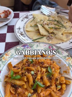A recent eat I can’t stop thinking about 🍝💗  Gabbiano’s @gabbianospdx is a neighborhood Italian-American spot in NE Portland serving up comfort food, cocktails & retro vibes. The perfect combo for a night out! 💖 Their menu has staple favorites alongside rotating dishes inspired by seasonal flavors and ingredients. This was another spot that had been on my list forever after so many recs, and I finally got to try it with my favorite girlies 👯‍♀️ What we ordered: ✧ House White Wine ✧ Aperol Spritz ✧ Signature Cocktails ✧ Fried Mozzarella ✧ Stone Fruit Panzanella ✧ Dungeness Crab Alla Vodka ✧ Sweet Corn Ravioli This spot is so well-known and hyped that I was a little skeptical about whether it would live up to expectations, but it definitely exceeded them 😭 Everything tasted fresh and flavorful, and each dish stood out in its own way, which made picking favorites so hard. 🥺😥 If I had to choose one appetizer and one main, I’d come back for the Stone Fruit Panzanella & Dungeness Crab Alla Vodka in a heartbeat. 🥹🫶 The peaches and heirloom tomatoes paired SO perfectly together and made for the ultimate summer dish ☀️🍑🍅 The dungeness crab was sweet and shredded throughout the pasta, so you got a little in every bite with their yummy spicy vodka sauce 🤌 The vibes and food were both too good! 🙂‍↕️ I can totally see why everyone loves this spot and why there’s usually a wait!! Already wanting to come back to try more of the menu, and I definitely have my eye on the tiramisu next 🍽️🍰 📍Gabbiano’s | Portland, OR  💸 Around $40+ per person  🏷️ #gabbianos #portlandeats #portlandfoodie #pdxfoodie #pdxeats italian food in portland oregon • portland eats • portland foodie • pdx restaurants
