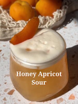 Honey Apricot Sour 🍯🍑 1 sliced apricot  .75 fresh lemon juice  1 oz honey syrup 1 egg white  2 oz gin Combine all ingredients to a cocktail shaker. Dry shake (no ice) then shake with ice. Strain into cocktail glass and garnish with an apricot slice  Honey syrup- 1 cup honey ½ cup water In a saucepan combine honey and water. Bring to a boil on low/medium heat. Stir until honey dissolves. Remove from heat and let cool #cocktailrecipes #ginsour #apricots #drinksathome #summercocktails 