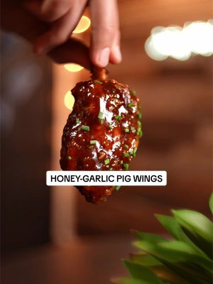 Honey-Garlic Pig Wings 🍯🐖 Smoked over Cherry wood pellets from @Bearmountain BBQ 🍒 🐻  Pig wings are small cuts off a pork shank and shaped kind of like a big chicken drumette. They eat a lot like baby back ribs, but with way more meat on each piece. Truly one of the most underrated cuts in Barbecue 🔥  🔹Pig Wing Ingredients * Pig wings (pork shanks) * Low-sodium pork rub * 2 tbsp soy sauce * 4 tbsp melted lard * Honey garlic glaze (recipe below) * Cherry Bear mountain BBQ pellets 🔹Pig Wing Method: 1. Season the pig wings generously on all sides with the low-sodium pork rub. 2. Preheat your smoker to 250°F and smoke the pig wings until they reach an internal temperature of 165°F. 3. Place the pig wings in foil and drizzle with 2 tbsp soy sauce and 4 tbsp melted lard. 4. Wrap tightly and return them to the smoker. 5. Continue cooking at 250°F until the pig wings reach an internal temperature of 195°F and are tender. 6. Remove them from the foil and place them back on the smoker uncovered. 7. Brush generously with the honey garlic glaze. 8. Cook uncovered for another 10–15 minutes, until the glaze is sticky, glossy, and set. 🔸Glaze Ingredients: * 6 garlic cloves, finely diced * 1/2 cup honey * 1/4 cup dark soy sauce * 2 tbsp rice vinegar * 1/4 cup water * 1 tbsp cornstarch * 1 tbsp cold water 🔸Glaze Method: 1. Add the dark soy sauce, rice vinegar, water, and diced garlic to a saucepan. 2. Bring to a gentle simmer over medium heat and cook for 3–5 minutes, until the garlic starts to soften. 3. Stir in the honey until fully combined. 4. In a small bowl, mix the cornstarch and cold water together to make a slurry. 5. Slowly stir the slurry into the simmering glaze. 6. Cook for another 1–2 minutes, stirring constantly, until the glaze is thick and glossy. 7. Remove from the heat. The glaze will thicken slightly more as it cools. #pigwings #barbecue #bearmountainpartner 