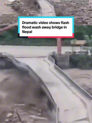 A massive flash flood swept away a bridge in Gajuri, Nepal, as deadly flooding devastated parts of the country. At least 160 people have been killed in Nepal and more than 400 are missing, authorities say. #nepal #flooding 