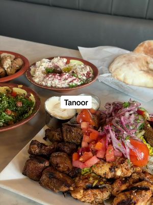 Mezze believe this spread was worth it. 😍 We ordered the “Mixed Grill for Two-Three” and it was the perfect way to sample a little bit of everything. It comes with your choice of three sides/appetizers, a variety of grilled meats, rice, and grilled veggies, so you really get a full taste of the menu. For our three, we picked the babaghanouge, tabouleh, and cauliflower and honestly, the combo was SO good. I’d order the grill again just to keep working my way through the rest of the sides. The pita deserves its own mention too: fresh, warm, and piping hot when it hit the table. 🫓 Service was wonderful from start to finish - kind, attentive, and prompt. With a few locations to choose from, definitely add this one to your list! #seattlerecommendations #seattlerestaurants #lebanesefood #seattlefoodie #seattlefoodies
