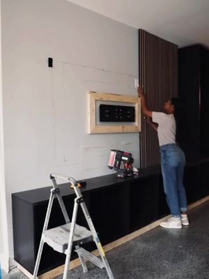 A few years later, this basement game room wall is still one of my most-asked-about DIY projects. I’ve received so many questions about the slat wall, hidden cords, floating center and cabinets, so I finally put all the answers in one video. It may look like a complicated custom build, but it’s actually a very approachable project—and proof that one feature wall can completely change how a room feels. Save this for your future basement or media-room makeover, and find everything I used through the link in my bio or comment INFO. thewoodveenerhub ikeausa homedepot worxtools #BasementMakeover #SlatWallDIY #MediaWallDIY #GameRoomDesign #DIYHomeProjects