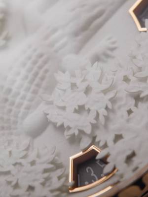 A Crocodile Made Of Paper Sculpture  An all-white crocodile appears to prowl through snow-covered vegetation from the dial's circular frame in the "Papercroc" timepiece. Fashioned entirely from white cotton paper, it stands as a testament to microscopic paper sculpting. This intricate 3-millimetre high composition, the result of months of experimentation, uses bespoke brass matrices to create subtle reliefs and delicate gradations of depth, showcasing innovative craftsmanship and the artisan's precise hand.  Métiers d'Art Tribute to the Animal Kingdom – Papercroc  #VacheronConstantin #OneOfNotMany