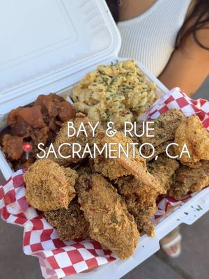 We left absolutely nothing on this plate 🤤🔥 Bay anh Rue Urban Kitchen is a family-owned soul food and Southern comfort restaurant. You order at the window then wait outside to pick up your food! We got a plate with 3 meats and 2 sides to share but definitely will have to come back to try more things!  Here’s what we got: 🍗 3 Way Combo - $37  (Catfish, Prawns, Wings + Candied Yam, Mac N Cheese) 📍Bay & Rue Urban Kitchen - 1121 Del Paso Blvd, Sacramento, CA 95815