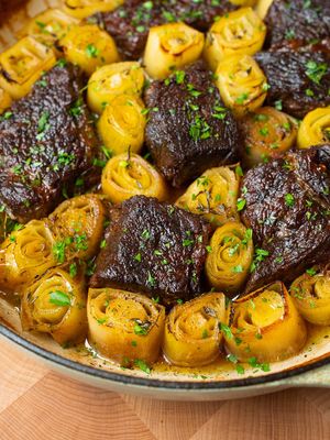 You’ve never had braised beef quite like this. This braised chuck roast with leeks is one of my favorite Rosh Hashanah centerpieces. The leeks become soft and almost melt into the braising liquid, while the beef gets incredibly tender and full of flavor. It’s festive, comforting, and one of those dishes my mom was always proud to bring to the table year after year. Recipe below. Shana Tova Umetuka Ingredients For the braised beef 3 lb chuck roast, cut into large 3-inch chunks Kosher salt, to taste Freshly ground black pepper, to taste 2 tbsp neutral oil, such as avocado oil 1-2 medium shallots, quartered 5-6 garlic cloves, peeled ⅓ cup dry white wine, such as Chardonnay 1 tsp whole black peppercorns 3 bay leaves Small pinch ground turmeric, optional Water, as needed For the leeks 3-4 medium leeks Kosher salt, to taste Freshly ground black pepper, to taste 1 tsp fresh thyme leaves About 1½ to 2 cups reserved braising liquid, plus more as needed 1-2 tbsp extra-virgin olive oil For serving Chopped fresh parsley, for garnish Extra-virgin olive oil, for drizzling Fresh thyme leaves, for garnish, optional Crusty bread, for serving Instructions: 1.⁠ ⁠Preheat the oven to 325°F (165°C). 2.⁠ ⁠Season the chuck roast generously with salt and black pepper on all sides. 3.⁠ ⁠Heat a large Dutch oven over medium-high heat. Add the neutral oil. Once hot, add the beef, working in batches if necessary to avoid overcrowding. Sear for 3 to 4 minutes per side, until deeply golden brown. Transfer to a plate. 4.⁠ ⁠⁠Reduce the heat to medium. Add the shallots and garlic and cook for 1 to 2 minutes, until lightly golden. Pour in the white wine and cook, scraping up any browned bits from the bottom of the pot, until the wine has mostly reduced, about 1 to 2 minutes. Add the peppercorns. 5.⁠ ⁠⁠Return the beef to the Dutch oven. Add enough water to come about two-thirds to three-quarters of the way up the sides of the beef. Add the bay leaves. 6.⁠ ⁠⁠Season the liquid lightly with salt and add the turmeric, if using. 7.⁠ ⁠Bring the liquid to a gentle simmer, then cover and carefully transfer the Dutch oven to the oven. Braise for 1 hour 45 minutes to 2 hours 15 minutes, until the beef is tender but not falling apart and still holding shape. A knife should slide into the meat with just a little resistance. 8.⁠ ⁠⁠Remove from the oven and increase the oven temperature to 375°F (190°C). Transfer the beef to a large oven-safe braiser or baking dish, leaving space between the pieces for the leeks. Strain the braising liquid and reserve it, then skim off and discard any excess fat from the surface. 9.⁠ ⁠⁠Discard the shallots, peppercorns, and bay leaves. You can reserve the softened garlic for serving, if desired. 10.⁠ ⁠⁠Trim the root ends and dark green tops from the leeks and remove any damaged outer layers. Cut the leeks into 2½ to 3-inch pieces. Rinse them carefully to remove any dirt between the layers while keeping the pieces intact, then pat dry. If needed, place the leeks in a large bowl of cold water and gently move them around to loosen any trapped dirt, then pat dry. 11.⁠ ⁠⁠Arrange the leeks around the beef. Season with black pepper, and thyme. Pour in enough reserved braising liquid to come about one-third of the way up the beef and leeks. Avoiding pouring it directly over the exposed sides of the leeks. Cover and bake for 30 to 35 minutes.  12.⁠ ⁠⁠Remove the lid. Brush the exposed tops of the leeks with extra-virgin olive oil and spoon a little braising liquid over the beef. Increase the oven temperature to 425°F (220°C) and roast uncovered for 15 to 20 minutes, until the leeks develop browned edges and the beef is glossy. 13.⁠ ⁠⁠For deeper color on the leeks, broil for 1 or 2 minutes, watching closely to prevent burning. See Notes. 14.⁠ ⁠⁠Remove from the oven. Taste the braising liquid and adjust with salt and black pepper, if needed. Finish with a light drizzle of extra-virgin olive oil and garnish with chopped parsley and fresh thyme leaves, if using. 15.⁠ ⁠⁠Serve warm with crusty bread.