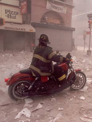 25 years after the 9/11 attacks, we remember the lives lost and honor the courage, service and sacrifice of the countless heroes who answered the call in the aftermath. Today, we are proud to share the story of @New York City Fire Department firefighter Tim Duffy, who was captured in an iconic photo navigating through the rubble of the South Tower on his way to Ground Zero to help following the attacks. We partnered with Old School Harley-Davidson to restore @1 Soldier 1 Dog 1 Team’s legendary Dyna Super Glide Sport, which carried Tim to and from Ground Zero in the months following 9/11 while he aided in the recovery, rescue and cleanup efforts. Tap the link in our bio or head over to our YouTube channel to watch Tim's story. 🎥 Maurice Delage III #HarleyDavidson