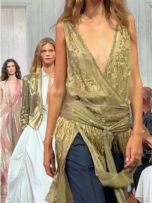 A silk-satin crossover top, embellished with cascading tonal beadwork.   #RalphLaurenSpring27 #RalphLauren #RLCollection #NYFW 