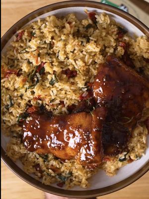 #ad This sticky apple cider glazed chicken with garlic butter sundried tomato & spinach rice is the perfect cozy weeknight dinner you need, made with @Kerrygold USA Recipe below. Chicken  1 ½ pounds boneless, skinless chicken thighs kosher salt and pepper ½ tbsp teaspoon smoked paprika ½ tbsp garlic powder  ½ tsp Chinese 5 spice powder  ½ tbsp fresh grated ginger  ½ tbsp Italian seasoning  2 tbsp olive oil  4 tbsp KerryGold Salted Irish Butter 2 rosemary sprigs  Sticky Apple Cider Glaze  4 tbsp KerryGold Salted Irish Butter, divided  4 garlic cloves, minced  ¼ cup Honey   1 cup apple cider ½  tbsp Dijon mustard  1 tbsp Apple cider vinegar  RICE  3 cups cooked jasmine rice, preferably chilled or room temp 3 tbsp Kerrygold Garlic & Herb Butter ⅓–½ cup sun-dried tomatoes, drained  2 cups packed fresh baby spinach, rough chopped  Salt, only if needed to taste  1 tsp Chicken bullion powder  INSTRUCTIONS  1. Season chicken thighs with smoked paprika, garlic powder, chinese five spice, fresh ginger, italian seasoning, salt, pepper olive oil and mix well until every piece of chicken is coated well.  2.Next add 2 tbsp of oil to a pan on medium high heat and sear each piece of chicken until it is charred.  3.To the pan add 4tbsp Kerrygold butter and fresh rosemary and start basting the chicken thighs. 4.Remove and add in 2 more tbsp of KerryGold Butter then go in with minced garlic saute for 1 minute then Deglaze with apple cider, scraping up all that goodness. 5.Add honey + Dijon + small splash apple cider vinegar. 6.Reduce over medium/medium-low until it becomes noticeably syrupy. Remember it’ll thicken more as it cools. 7.Lower the heat or take the pan off the heat, then whisk/swirl in another 2 tbsp Kerrygold butter. Now you’ve got that glossy, buttery apple-cider pan sauce. Add your chicken back, turn it around in the glaze and spoon/baste the sauce all over it 8.Melt Kerrygold Garlic & Herb Butter in a skillet. 9.Sauté sun-dried tomatoes and spinach. 10.Toss in cooked jasmine rice. 11.Season to taste and enjoy!