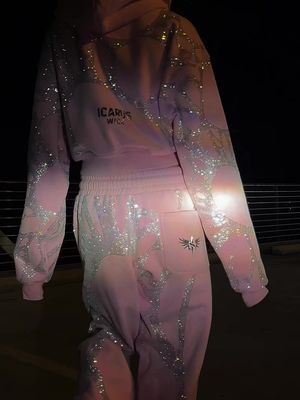 POV: you finally found the pink rhinestone sweatsuit everyone is about to ask you about 💎🎀 The ultimate cool-girl outfit: perfectly oversized, blanket-soft, and covered in rhinestones that sparkle with every step. Pre-order yours now at icaruswick.com before the pink sells out.