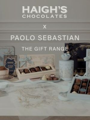 HAIGHS CHOCOLATES x PAOLO SEBASTIAN Nestled amongst the woodlands, a nightingale discovers a cocoa bean… A tale of two artists; this exclusive collaboration celebrates the beauty and storytelling of Haigh’s Chocolates and Paolo Sebastian. Worlds collide with the melding of two iconic brands in this enchanting new gift range, featuring signature design motifs. The cocoa bean and flower, a nod to Haigh’s history and chocolate making; and the nightingale, the graceful songbird and heritage symbol of Paolo Sebastian couture house. Together, a new Gift Range is born. One steeped in the romance of discovery and the rich delight of indulgence, creating an experience that is truly unforgettable - and turning each gift into something treasured. The Gift Range will be available to purchase online and in-store from tomorrow 22.09.2026