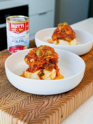 Mediterranean-Style Tomato-Braised Chicken Thighs This is one of those easy weeknight meals that tastes like you put in way more work than you actually did. Chicken thighs braised in Mutti Polpa with fennel, shallots, garlic, Calabrian chili, olives and capers, then finished with fresh parsley. I love using Mutti Polpa here because the tomatoes are picked at the right stage of ripeness and processed to preserve their fresh, vibrant tomato flavour. Mutti works closely with around 800 selected tomato-growing families in Italy, building long-term, transparent relationships to help produce consistently high-quality tomatoes. Serve this with creamy mashed potatoes, rice, or some crusty bread to soak up all that tomato sauce. RECIPE Ingredients  • 4 bone-in, skin-on chicken thighs  • 2 tbsp olive oil  • 1 shallot, thinly sliced  • 2 garlic cloves, thinly sliced  • 1 fennel bulb, trimmed and thinly sliced  • 1 tbsp Calabrian chili paste  • 1 can Mutti Polpa  • 1/4 cup olives  • 1 tbsp capers  • 1 tsp paprika  • Salt, to taste  • Freshly cracked black pepper, to taste  • Fresh parsley, chopped Method 1. Season the chicken thighs generously with salt, pepper and paprika. 2. Heat the olive oil in a large oven-safe skillet over medium-high heat. Place the chicken skin-side down and sear until deeply golden and crisp. Flip and sear the other side. Remove the chicken and set aside. 3. In the same pan, add the shallot, garlic, Calabrian chili and fennel. Season lightly with salt and cook until the vegetables soften and become fragrant. 4. Add the Mutti Polpa and bring everything to a gentle simmer. Season with salt and freshly cracked black pepper. 5. Stir in the olives and capers, then nestle the chicken thighs back into the sauce, skin-side up. 6. Transfer to a 350°F oven and cook for approximately 30–40 minutes, or until the chicken reaches at least 165°F internally. For a more tender braised texture, I like taking the chicken a little beyond the minimum safe temperature. 7. Finish with plenty of fresh parsley and serve with mashed potatoes, rice, or crusty bread. #ad @Mutti Pomodoro 