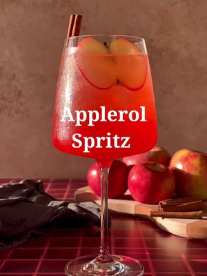 Ready for Fall 🥂🍎🍾 🍂 Apple Aperol Spritz 2 oz Aperol  2 oz apple cider 4 oz prosecco  1 oz sparkling water Apple slice and cinnamon stick for garnish  Add all ingredients to a wine glass filled with ice and garnish. . . . #cocktailrecipes #EasyRecipes #cocktail #cocktails #drinksathome 
