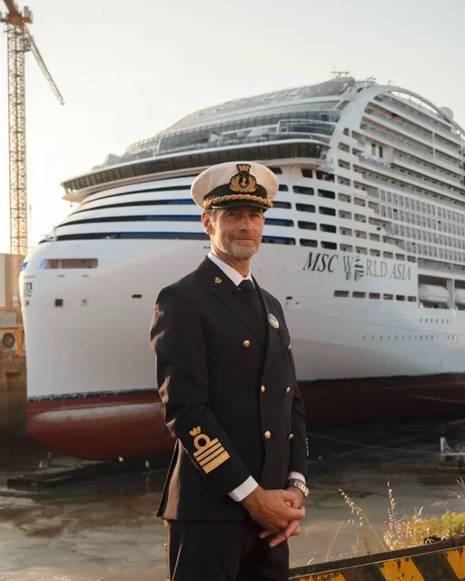 Captain Paolo Benini is already at the shipyard, watching MSC World Asia come to life day by day. Born in Liguria, inspired by a grandfather who worked in the Genoa shipyards and a father who was also a captain, his connection to the sea is a story shaped by family, heritage and a lifelong passion. Now, for the first time in his career, he has been appointed Captain of an MSC Cruises newbuild. He was on board during the sea trials. He knows every deck, every system, every detail of a ship he is preparing to command. And when MSC World Asia sets sail from Barcelona on 4 December 2026, Captain Benini will be at the helm, leading his crew and welcoming the very first guests on board. The countdown has begun. #MSCCruises #MSCWorldAsia #TheArtOfCruising #cruisecaptain #captain
