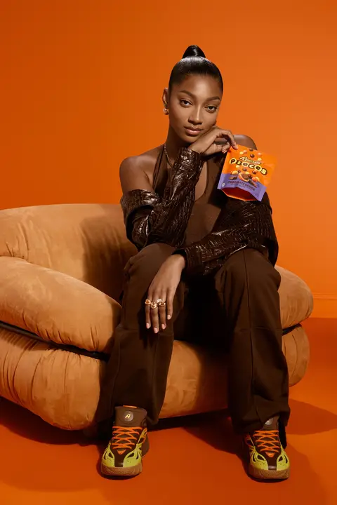 New PIECES. New kicks. Same iconic combo. The new REESE’S PIECES with Chocolate Cookie brings a crispy chocolate cookie center to the peanut butter Angel loves, and now it's paired with the latest @Reebok drop. Coming soon. #AngelReese #REESESPartner