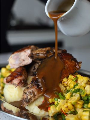 Jerk Cornish hens with buttery mashed potatoes, charred corn salsa & pan gravy. Big flavour, simple ingredients, and one hell of a dinner. Jerk Cornish Hens 3 Cornish hens Jerk marinade Neutral oil Lime + vinegar Charred Corn Salsa 3 ears corn 2 green onions 2 bird’s eye chilies 1 lime Olive oil Salt + pepper Mashed Potatoes 3 Yukon Gold potatoes Butter Heavy cream Salt Pan Gravy ½ cup chicken stock Butter Method Spatchcock and clean the hens with lime, vinegar and water. Rinse, pat dry, coat generously with jerk marinade and refrigerate at least 4 hours, preferably overnight. Heat a large cast iron with neutral oil. Sear hens skin-side down, weigh them down, then roast at 425°F for 30–35 minutes or until cooked through. Boil corn until tender, season with oil, salt and pepper, then grill or char. Cut from the cob and toss with green onion, bird’s eye chili, lime zest, lime juice and olive oil. Boil potatoes in salted water until tender. Rice, then mix with melted butter, warm cream and salt. Remove hens from the pan. Add chicken stock to the fond, scrape well and simmer. Stir in a knob of butter and strain. Plate it all up and don’t forget that gravy. #EasyRecipes #asmr  #cornishhen #cheapeats 