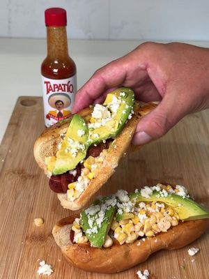 🌭 How many are you making? Bacon wrapped hotdog with Tapatio  corn and avocado is the perfect flavor combo 👇 Send this to a person that would love these