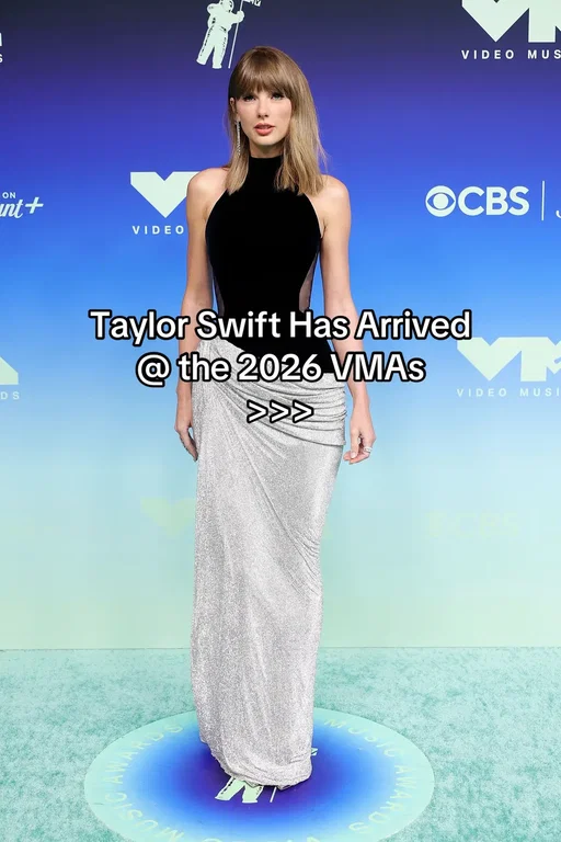 The showgirl has arrived! #TaylorSwift is dressed to make history at the 2026 #VMAs. Set to receive the inaugural Artist Director Honors at tonight’s ceremony, the singer opted for a black sleeveless #TamaraRalph gown for the occasion with a little nod to the showgirl life by way of a silver sequined skirt. Tap the link for more details. 