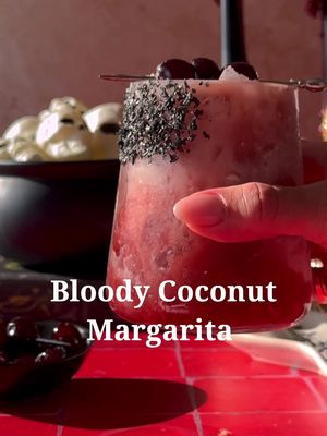 Creamy, coconutty, and a little bloody 🧛🏼‍♀️ Cherry Coconut Margarita 🩸🥥  .75 oz  fresh lime juice 1 oz cream of coconut (Coco Lopez)  .5 oz orange liqueur  2 oz tequila  1 oz tart cherry juice  Agave and black salt for rim of the glass Maraschino cherries for garnish  Start by rimminb a cocktail glass with agave and then into black sea salt. Set aside. In a cocktail shaker combine lime juice, cream of coconut, orange liqueur, and tequila, fill with ice and shake until cold. Strain into your prepared glass filled with crushed ice. Slowly pour in cherry juice on top.  . . . . #cocktailrecipes #EasyRecipes #halloweenrecipes #coconutmargarita #halloweencocktails 