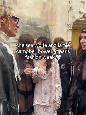 someone tag the lip reading girl I need to know what they’re talking aboutttt #chelseawolfe #jamiecampbellbower #parisfashionweek #annedemeulemeester 
