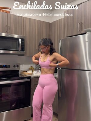 ENCHILADAS SUIZAS, but make them macro-friendly 🇲🇽💚 As a Latina who has lost 145 LBS, one thing I will NEVER do is give up my Mexican food! It’s all about moderation, portions, and learning to make little adjustments without sacrificing FLAVOR! 🤌🏼 🌶️ INGREDIENTS For the chicken: * Chicken * Onion, tomato & 1 large garlic clove * Chicken bouillon For the salsa: * Tomatillos * 2 jalapeños & 3 serranos * 4 poblano peppers * Chicken bone broth (extra protein!) * Reduced-fat cream cheese * Cacique Mexican crema * Cilantro For the enchiladas: * Corn tortillas * Shredded chicken * Low-fat mozzarella cheese 👩🏻‍🍳 LET’S COOK! 1. Cook your chicken: Add chicken, onion, tomato, garlic, bouillon, and water to your pressure cooker. I cooked mine for 1 hour and 20 minutes until tender, then shredded it. Cooking time depends on your pressure cooker. 2. Soften your veggies: Add tomatillos, jalapeños, and serranos to the HOT leftover chicken broth. Cover and let them soften on warm without boiling until they burst. This helps avoid an overly sour salsa! 3. Roast your poblanos: Air-fry until blistered, steam in a bag, then peel. 4. Blend your salsa: Blend the softened veggies, cooked onion, tomato, garlic, poblanos, cilantro, bone broth, cream cheese, and Mexican crema until smooth. For thicker salsa, use less broth! 5. Heat your salsa: Pour into a cool pan, turn on low heat, and bring to a gentle simmer so the creamy salsa doesn’t separate. 6. Assemble: Instead of frying my tortillas, I microwaved them until soft! Fill with shredded chicken, roll them up, and place in a baking dish. Cover with salsa and shredded low-fat mozzarella. 7. Bake: Bake for 25–30 minutes until hot and bubbly, then broil for about 5 minutes until golden. Keep an eye on that cheese! 8. ENJOY! I served mine with asparagus instead of rice this time. Not because carbs are bad, but because it’s what I wanted for my meal prep! 145 LBS DOWN and still enjoying the food I grew up eating! 💚 Losing weight never meant eating boring food. I simply learned how to make my favorite meals work with my goals while focusing on protein, muscle growth, and balance! SAVE THIS RECIPE, GIRL! 🇲🇽 Outfit: @AYBL  #enchiladas #dinner #cookwithme #outfitoftheday #food 