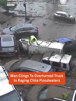 A dramatic scene unfolded in Santiago, Chile, as powerful floodwaters swept away vehicles, including an overturned truck with a man desperately trying to escape. He managed to climb onto the truck's roof before grabbing onto a tree and reaching safety.