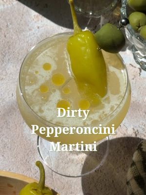 The dirtiest martini on your feed 🫒🍸 2 1/2 oz vodka or gin  1/4 oz vermouth 1 1/2 oz olive brine 1/2 oz pepperoncini brine Pepperoncini and an olive, for garnish Olive oil, for drizzling Shake with ice until cold, strain into a chilled coupe, garnish with a pepperoncini and an olive, drizzle with olive oil. #dirtymartini #martini #pepperoncini