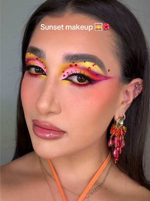 ✨🏵️🌺🌅SUNSET MAKEUP 🌅🌺🏵️✨ I am absolutely in love this these colors! As Zara Larsson once said “SUMMER ISN’T OVER YET 🎶”. In all seriousness please enjoy this sunset makeup look while I cook up some Halloween looks 🤭  PRODUCT DETAILS 👉🏼 FACE 🌅 @DanessaMyricksBeauty  Yummy Skin Blurring Balm Powder 🌺 @rhode skin Glazing Milk  🏵️ @anua_global PDRN Hyaluronic Acid Mist ✨ @Morphe Cosmetics Peptide Bronzing Serum  🌅 @Charlotte Tilbury Airbrush Flawless Blur Concealer 🌺 @Benefit Cosmetics The POREfessional foundation  🏵️ @milkmakeup Matte Bronze Stick (Baked) ✨ @Juvia’s Place Blushed Liquid Tints (Coral Sunset & Flamingo Rose) & Blushed Duo (Vol 6) 🌅 @KimChi Chic Beauty  Puff Puff Pass Loose Setting Powder *USE CODE “LEXILALAMAKEUP15” FOR 💰 OFF 🌺 @M·A·C Cosmetics Matte Sunstruck Bronze (Light Golden) 🏵️ @Hard Candy Blue on Lock Setting Powder (Translucent Pink) ✨ @wetnwildbeauty Chameleon Chrome Highlighter (Soft Ember) BROWS 🌅 @Rare Beauty  Brow Harmony Brow Gel 🌺 @NYX Professional Makeup Blade & Shade Eyebrow Pencil  EYES 🌅 @bellabeautebar Arch of Color Eyeshadow Palette *USE CODE “Lexilalamakeup” FOR 💰 OFF 🌺 @maccosmetics Paintstick Pro Palette  🏵️ @ColourPop Cosmetics Creme Gel Eyeliner (Punch) ✨ @urban decay 24/7 Inks Easy Liquid Eyeliner Pen (Zero) GLITTER/SPARKlE 🌅 @JELLIWINK COSMETICS c Pigment (Imogen) 🌺 @SHEGLAM Go Go Glow Highlighting Mist (Love Bomb) LIPS 🌅 @morphebrushes Signature Lip Pencil (Dearest) 🌺 @Kaleidos Makeup Glassload Lip Melt (Clean Slate)  🏵️ @colourpopcosmetics X Hannah Montana Shimmer Lipgloss (Secret Superstar)  Makeup, Makeup trends, Halloween, Sunset makeup, Orange, Colorful makeup, Makeup inspo, Glam, Rhinestones 