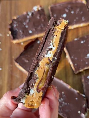 Super duper easy to make dairy free gluten free no bake yummy chewy chocolate bars!  To make- split medjool dates in half and lay flat on lined baking sheet. Squish down. In a bowl - take about 1 cup of peanut butter- enough to make a layer, 1/4 cup of hemp hearts, 1/4 cup of coconut (optional) sea salt, 2 tsp vanilla and mixed together and spread on dates. Melt chocolate and spread over peanut butter mixture. Sprinkle flakey salt on top and let cool in fridge or freezer! Enjoy!! #dates #datebars #glutenfree #dairyfree
