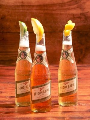 Only one way to find out.   Milwaukee 75 Pour out  2 oz of a Miller High Life 12 oz bottle Add 1 oz gin  Splash of simple syrup Squeeze in one lemon slice      Midwest Hugo Pour out  2 oz of a Miller High Life 12 oz bottle Add 1 oz elderflower liqueur 1/2 oz. lime juice Lime garnish #millerhighlife #beer #beertail #falldrinks #spaghett 