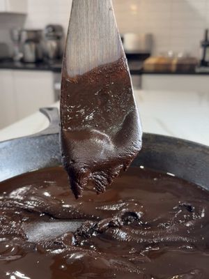 Some of y’all don’t have the PATIENCE to make a REAL dark chocolate roux! 👀😂 TWO AND A HALF HOURS stirring flour and oil in a cast-iron skillet! Was it necessary to take that long? Not necessarily! But controlling your heat is EVERYTHING when you’re trying to achieve that deep chocolate color without burning the flour. Both of my parents are from Mississippi, so I grew up understanding the importance of a good roux. That deep, toasted, nutty flavor is what makes a dark roux so special in gumbo! Now tell me… is spending 2½ hours making a roux dedication or just plain CRAZY?! 😂👇🏾 Inspo: @Adriánna Guillory-Bellow  Dark Chocolate Roux Recipe  Ingredients 2 cups vegetable oil 4 cups all-purpose flour Directions With the heat OFF, pour the oil into a large cast-iron skillet. Add the flour and stir until thoroughly combined and smooth. Turn the heat to medium and stir continuously, scraping the bottom and sides of the skillet to prevent scorching. The roux will gradually change from blonde to golden brown, then to peanut-butter brown. Mine reached the peanut-butter stage after approximately 45 minutes. As the roux darkens, gradually lower the heat while continuing to stir. I eventually reduced the heat to low to prevent burning. Continue stirring until you reach a deep, dark chocolate color and the roux develops a rich, roasted aroma. Once finished, let the roux cool for at least 30 minutes. Place a paper towel on the surface of the roux, then carefully peel it away to remove the excess oil from the top. After that, carefully transfer the roux to an airtight jar, or use it right away. Cooking Time: Mine took approximately 2½ hours, but depending on how well you manage your heat and maintain even cooking, you may be able to achieve the same results in considerably less time. #roux #louisiana #food #gumbo #cooking 