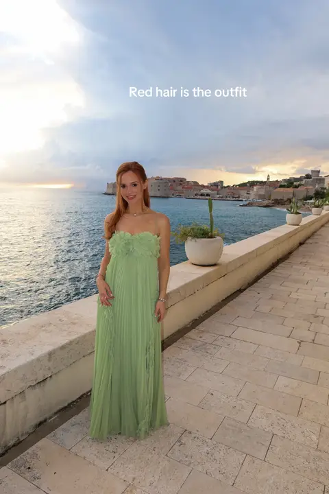 A redhead in green 