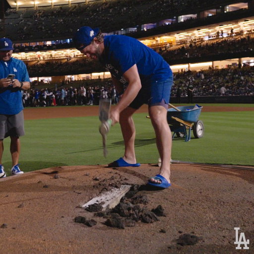 Removing the pitching rubber with Clayton and his kids. 👀 