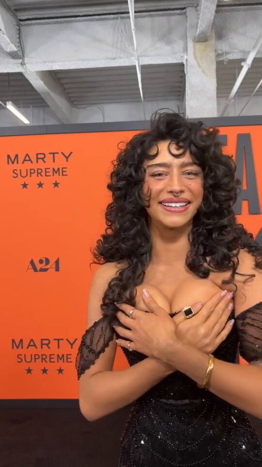Odessa A’zion gives Pop Crave a shoutout at the ‘Marty Supreme’ premiere. 