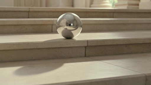 Grok Imagine understands our world better than you think.

Notice the reflection of the cameraman as the ball goes down, which was not specified in the prompt. Grok just knows that's where the cameraman would be to record this video.

> A shiny metal ball, polished to a mirror-like finish, begins rolling down a staircase.