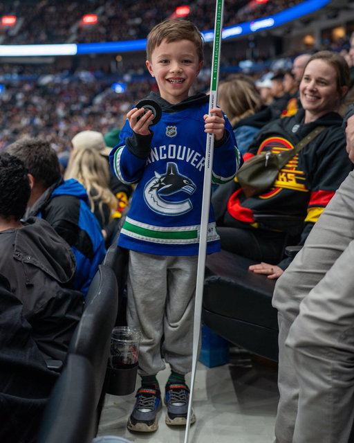 How about a Brock Boeser signed puck and an Elias Pettersson signed stick? 