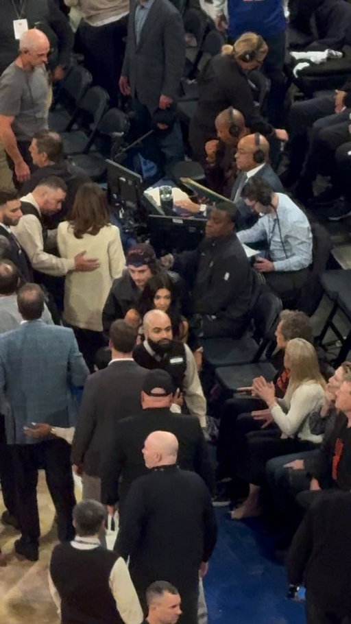Timmy and Kylie courtside, Skatt going over to Timmy. Love it 