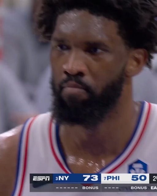 Knick fans taunting Embiid with printed photos of Mitch's poster 😂 