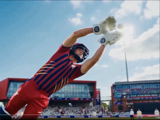 The classic T20 scenario where a wicketkeeper, wearing batting pads and batting gloves, plus a helmet, takes a diving catch parallel to the square leg umpire, who is next to TWO square leg fielders, both wearing whites, with floodlights on under midday blue skies.

AI sucks. 