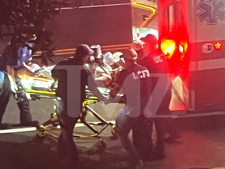 🚨 Exclusive photos show Lindsey Graham being carted out of his residence while surrounded by Emergency Medical Service workers administering first aid. 
